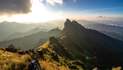 Majestic Mountain Peaks Bathed in Golden Sunlight at Sunrise.