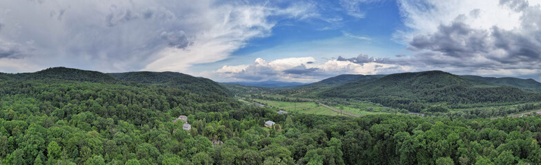 Green hills and forest landscape panorama in summer. Chynadiieve, Ukraine.
