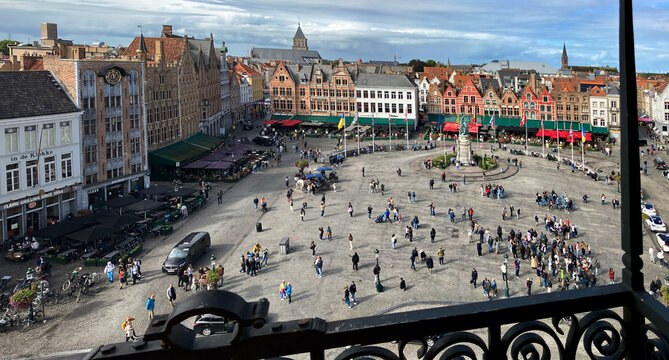 Bruges, Belgium &ndash; September 13, 2024 &ndash; Tourists in Grote Markt Square Bruges Belgium. Tourists in Grote Markt Square. The historic center of Bruges, Belgium.

