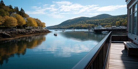 Obraz premium Scenic autumn harbor view with boats and mountains