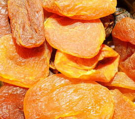 Closeup of dried apricots (kuraga) showing texture and vibrant orange color