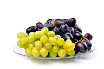 yellow and blue grapes on white plate