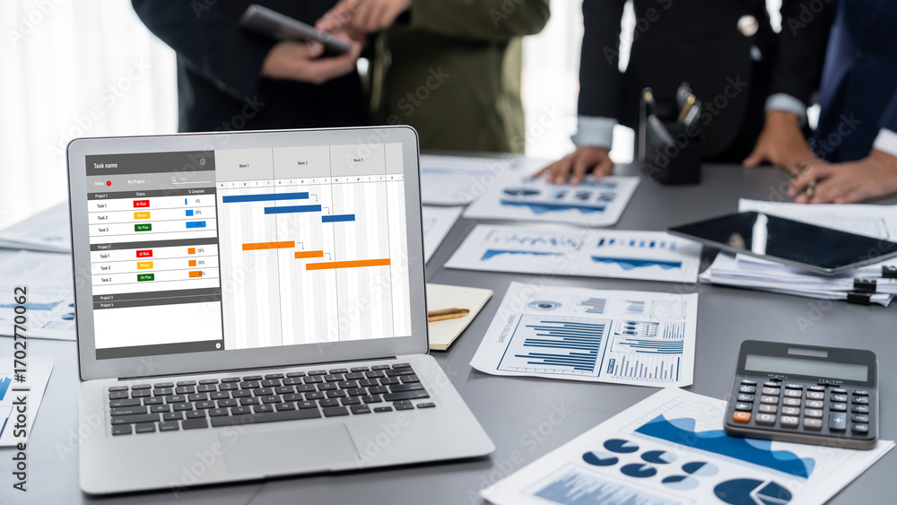 Fototapete project planning software for brisk business project management on the computer screen showing timel