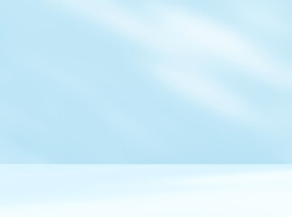 Empty blue room studio with shadow of leaves on concrete wall and floor for product presentation. Sunlight effect shadow. Minimal winter backdrop. Cosmetic, beauty and fashion showroom.