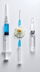 Syringes and a fruit slice on white