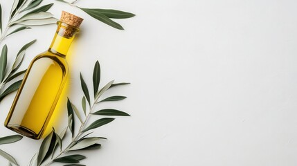 A glass bottle of olive oil is surrounded by fresh olive leaves on a light background, ideal for culinary websites, health blogs, or organic product promotions