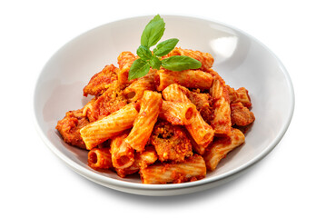 Macaroni tortiglioni pasta with tomato sauce, pieces of meat, and fresh basil leaves on a white plate isolated