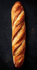 Freshly baked long loaf of bread, light golden-brown crust, and visible textures