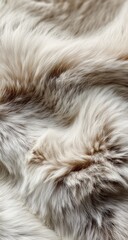 Fototapeta premium Close-up view of a soft, faux fur fabric. It's a light beige/cream color with subtle variations of brown. The texture is fluffy and luxurious, showing a wavy pattern