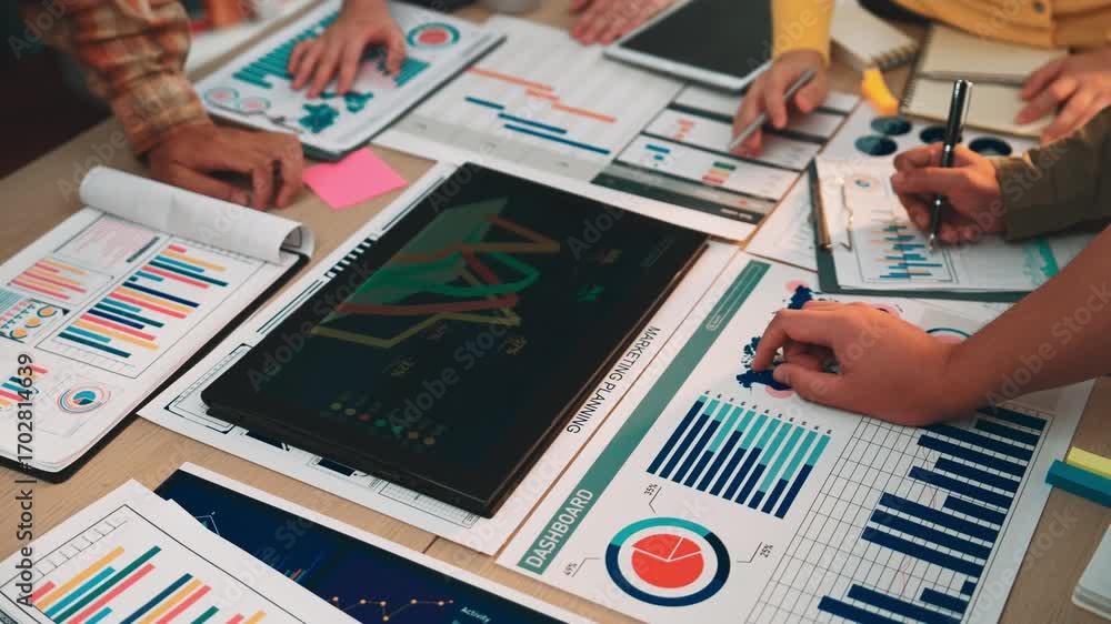 Aufkleber a diverse business team engages in collaborative financial analysis using a digital tablet to review