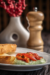 Toast with creamy herb dip and roasted peppers