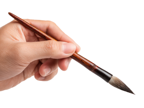 Close-up of hand holding a calligraphy brush