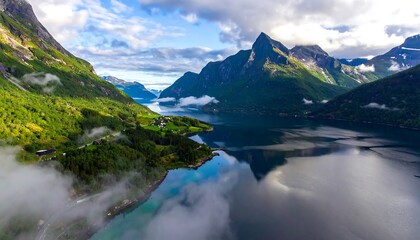 Fototapeta premium Misty fjord valley with mountains reflected