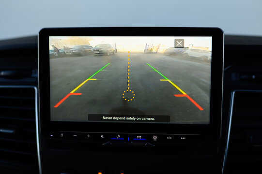 Reverse Camera Feed Displayed on Modern Car Screen - Powered by Adobe