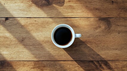 White coffee cup with black coffee on wooden table natural light morning breakfast background for cafe menu advertisement social media post minimalist cozy atmosphere relaxing