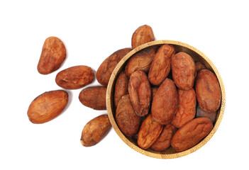 Raw cocoa beans in wooden bowl isolated on white background, top view, clipping pat