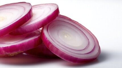 Sliced red onions stacked artfully against a clean background, showcasing their vibrant color and texture, Perfect for culinary articles, food blogs, or recipe books highlighting fresh ingredients,