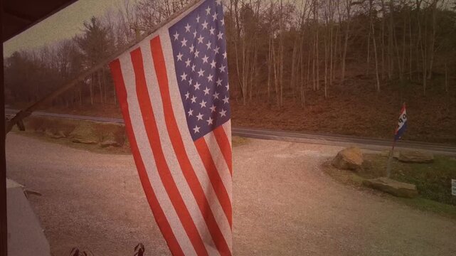 Vintage american flag waving in wind at store