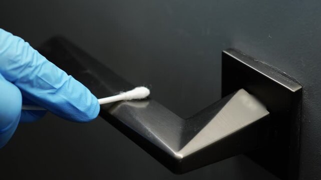 Testing for viruses and microbes with a cotton swab for laboratory research.
Taking swabbing samples from surfaces for virus testing.
Viruses on surfaces during a pandemic.
Crime, research, science