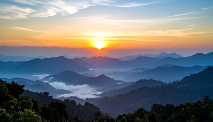 Sunrise over a misty mountain range