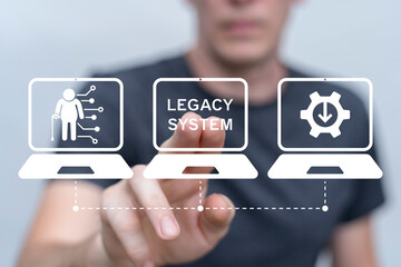 Legacy System Business Technology Interoperability Modernization concept. Person using virtual touch screen presses the inscription LEGACY SYSTEM.
