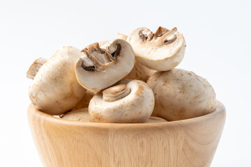 Fresh Organic Champignon Mushrooms in Wooden Bowl on White Background, Healthy Eating Concept