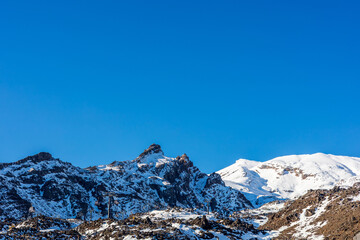 Snow Covered Mountain Peaks under Clear Blue Sky at Whakapapa Ski Field New Zealand