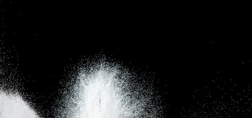Million of white sand explosion, Photo image of falling down shower snow, heavy snows storm flying. Freeze shot on black background isolated overlay. Tiny Fine Salt sands as particle science