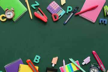 Frame made of different stationery supplies on school chalkboard