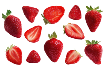 Fresh strawberry halves and whole berries, arranged in a pattern.  Bright red, juicy slices,  with green leafy tops.  High contrast, isolated on black