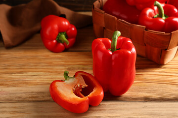 Red bell peppers on wooden background, closeup