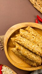 Wooden bowl of crispy snacks