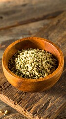 Wooden bowl of small, light-green and cream-colored seeds