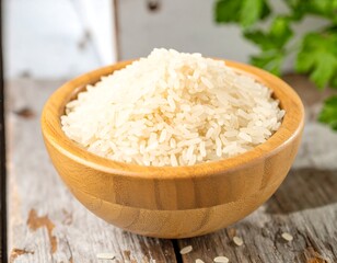 Wooden bowl of white rice on rustic table