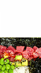 Colorful Tuna Poke Bowl with Avocado Edamame and Seaweed on a White Background