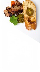 Grilled Meat Slices with Bread, Pickles, Tomato, and Cilantro on a White Surface