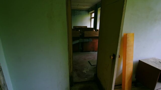 Interior view of the deserted Sanitary and Epidemiological Station in Pripyat, Ukraine, within the Chernobyl Exclusion Zone. This footage captures the eerie atmosphere and decay of a building left aba
