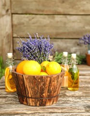 Wooden bowl with citrus fruits and lavender