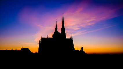 Silhouette of Gothic Cathedral Against Vibrant Sunset Sky image