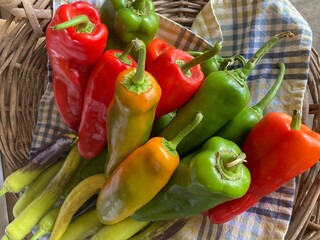 red and green peppers in basket