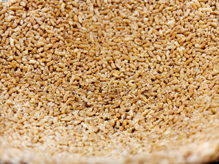 Close-up of brown guoba food with a rough texture