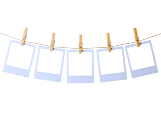 empty instant photo frames hanging on a clothesline with clothespins isolated on transparent background