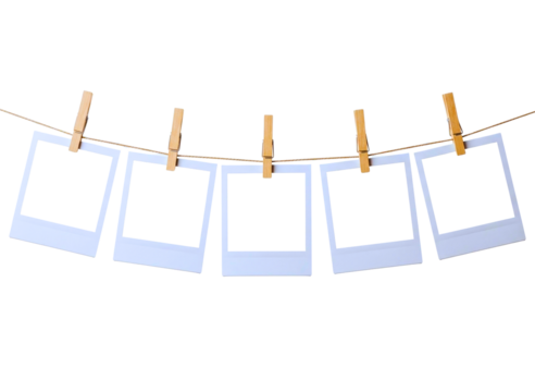 empty instant photo frames hanging on a clothesline with clothespins isolated on transparent background