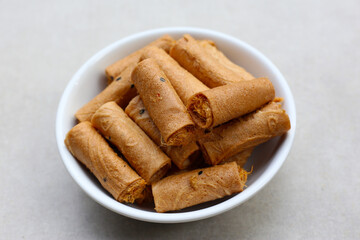 Rolled crispy wafers filled with shredded pork floss, Thai snack.