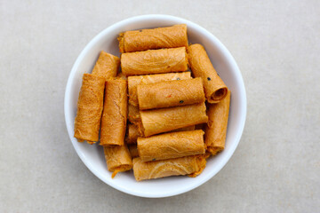 Rolled crispy wafers filled with shredded pork floss, Thai snack.