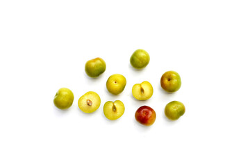 Fresh green plum fruit on white background.