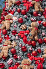 Cute soft doll decorated on Christmas tree during Christmas festival and New Year celebration.