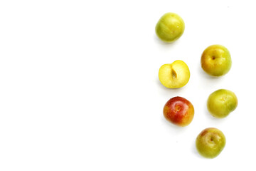 Fresh green plum fruit on white background.