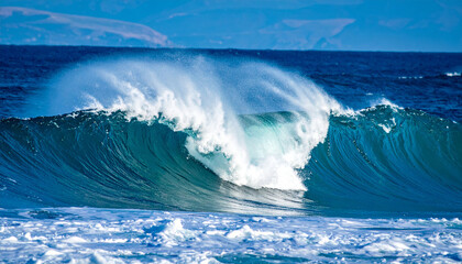 Fototapeta premium Splashing wave in the blue sea; natural background; high quality photo