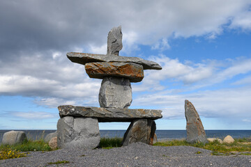 Stone Inukshuk on the coast of Hudson Bay, Inuit symbol of guidance, guidance, and community, Churchill, Manitoba, Canada

